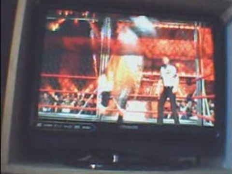 WCF HHH vs Rey Mysterio -steel cage