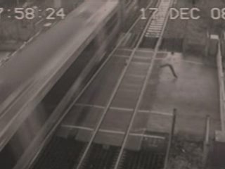 Man dodges a train at a level-crossing in Essex