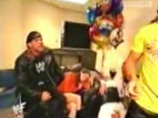 Edge and Christian play Triple H's music on a kazoo