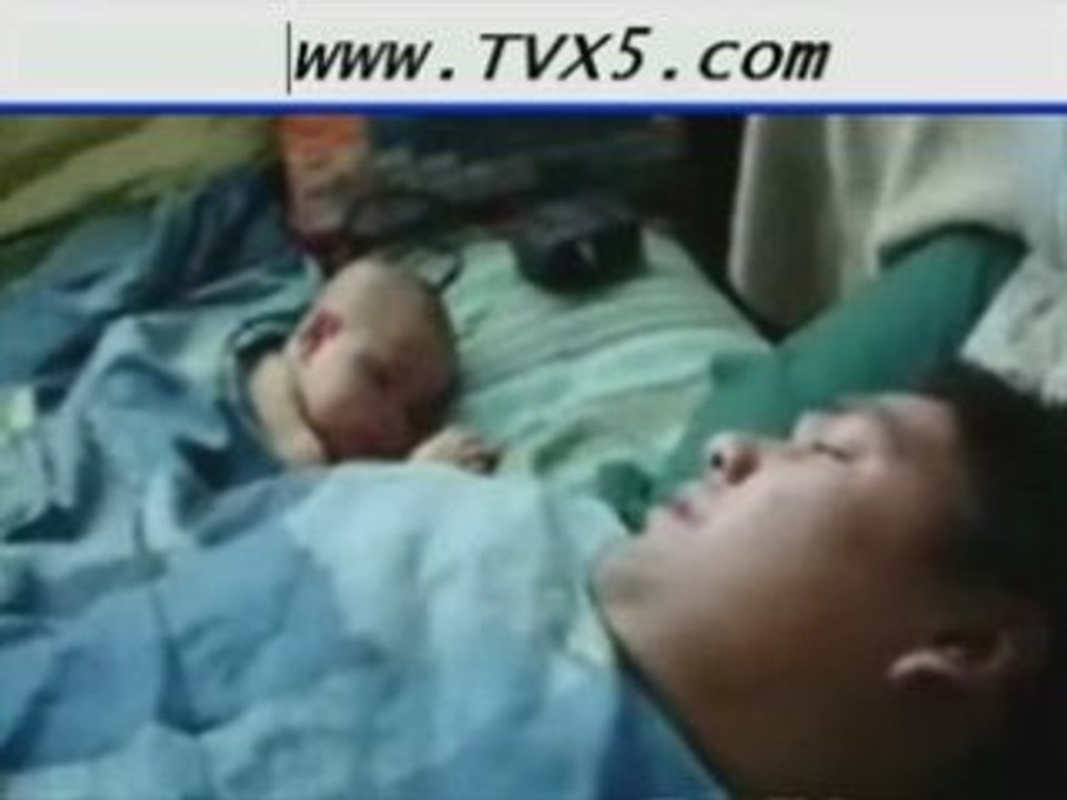 Daddy's snore wakes baby