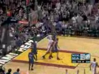 NBA Dwyane Wade flys in for the two-handed dunk.