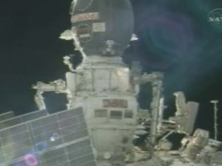 Astronauts prepare the International Space Station