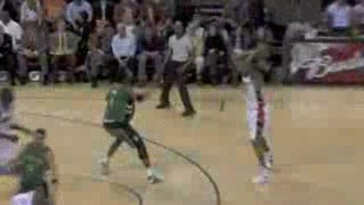 NBA Pops swats Diaw's shot into the crowd.