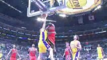 NBA Luke Walton drives to the basket. He slams over Ronny Tu