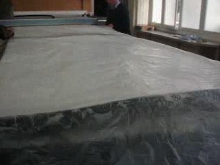 Vétigraph, compression d'un matelas avant découpe