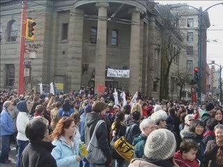 A LARGE GROUP GATHERS IN THE DTES OF VANCOUVER