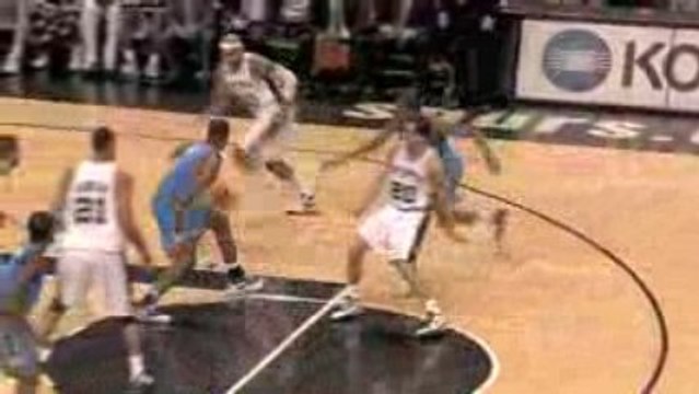 NBA Manu Ginobilli makes a pretty behind the back pass to Dr