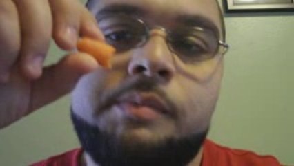 Fat Man Eating a Baby Carrot