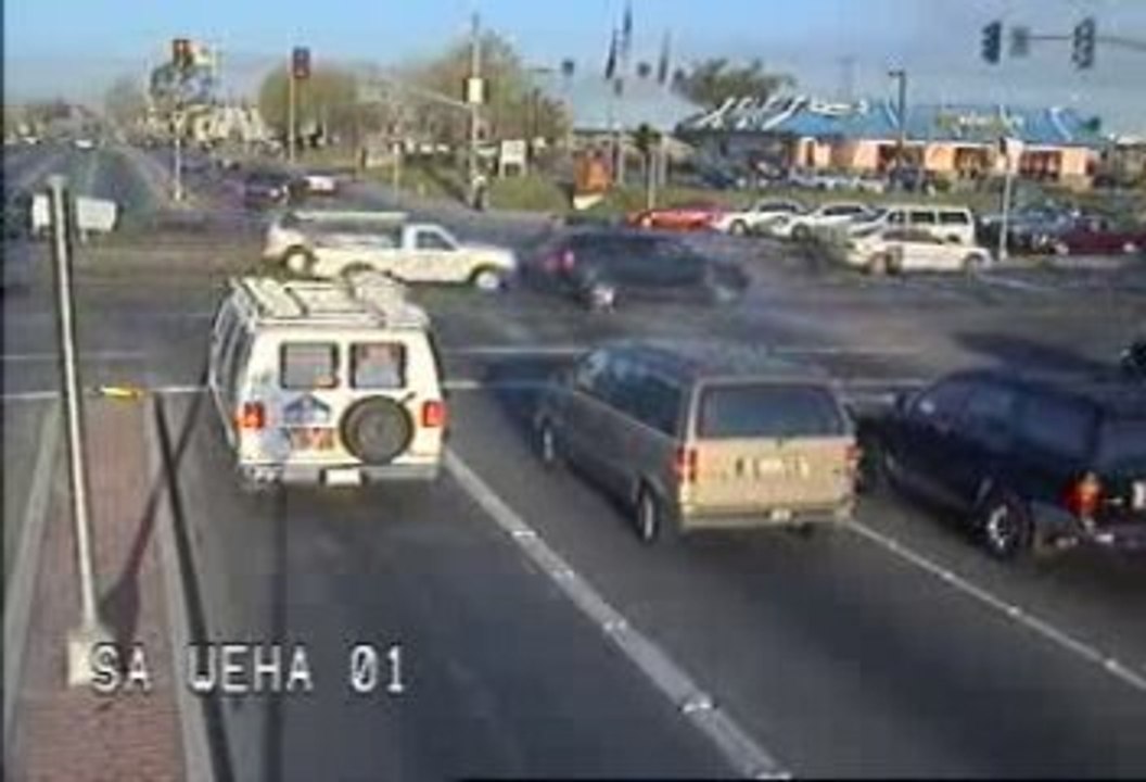 Car Going Through Cross Traffic - Video
