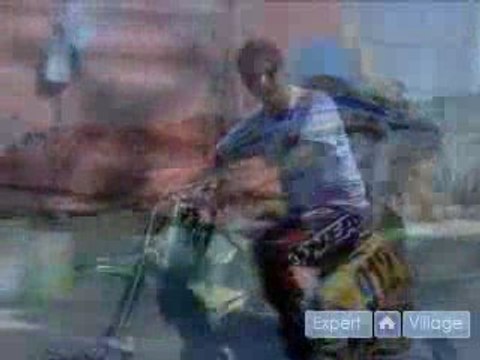 How to Ride Motocross Bikes : How to Wheelie on a Motocross