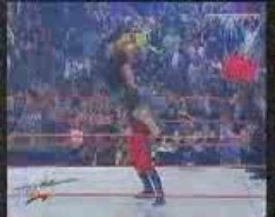 Kane returns (saves Undertaker & The Rock)