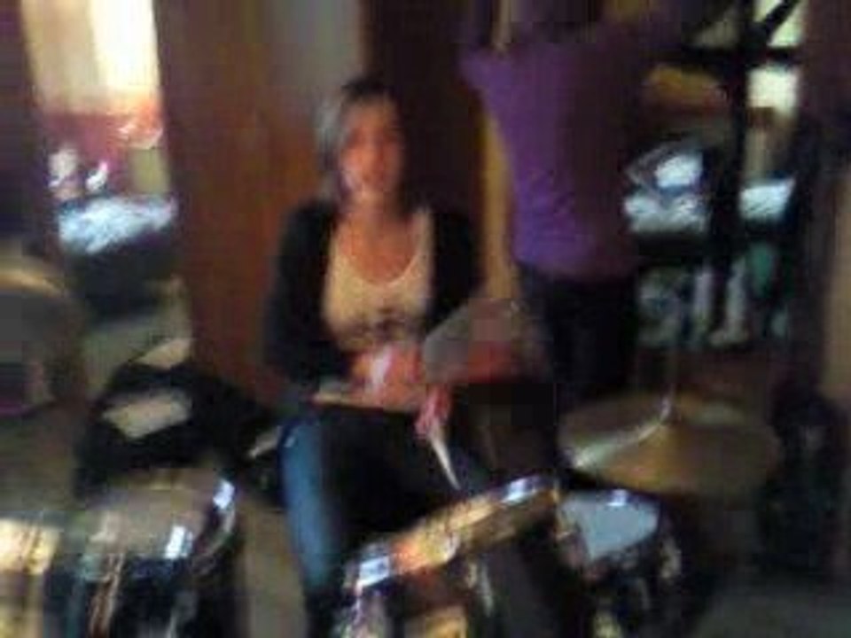 Coco play the drums