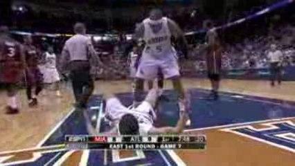 NBA Mike Bibby drives the lane and some how gets his shot to