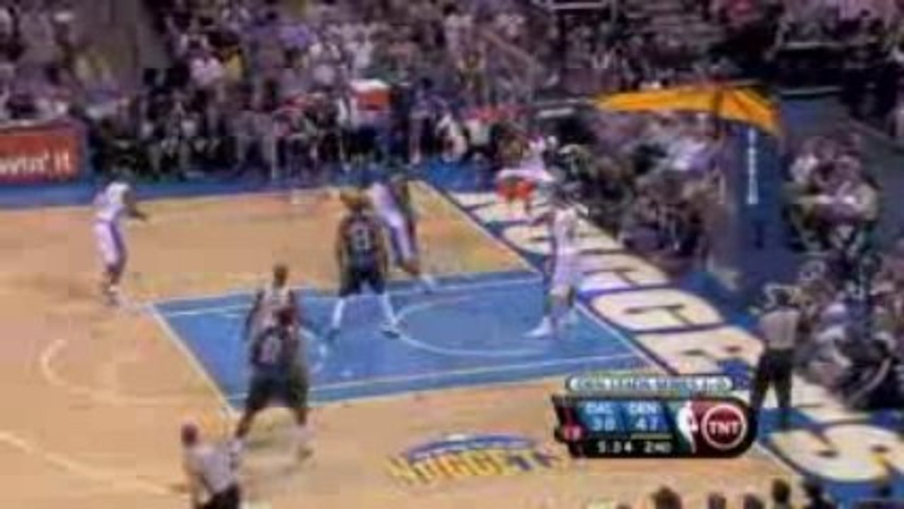 NBA Nenê blocks Jose Barea during the second quarter of the