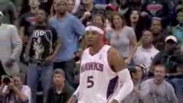 Josh Smith blocks LeBron James as he drives to the hole for