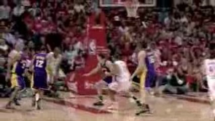 Kyle Lowry dishes to Carl Landry who drives the baseline for