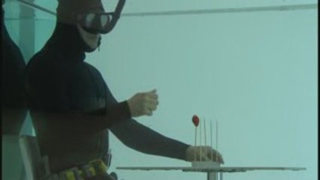 Aquarine experiment-man eating underwater in a tank