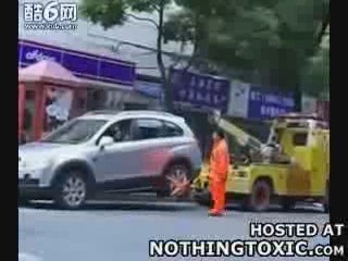 Woman in SUV Owns Tow Truck Guy - NothingToxic.com