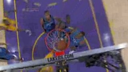 Kobe Bryant goes around, through and over a few Magic player