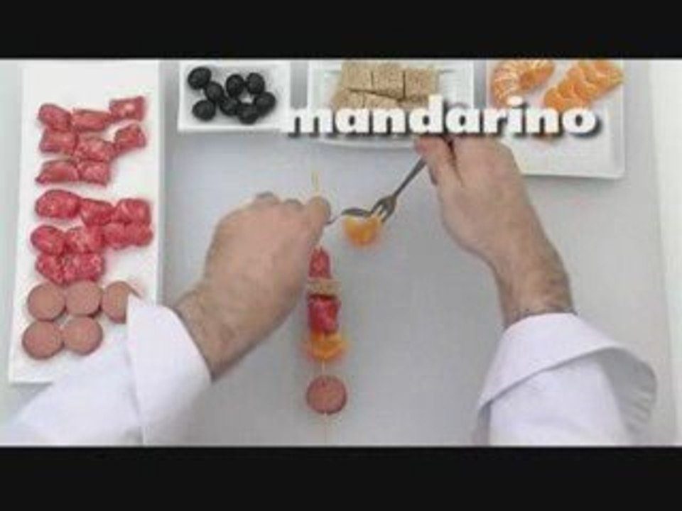 Spiedini di salsiccia e mandarini